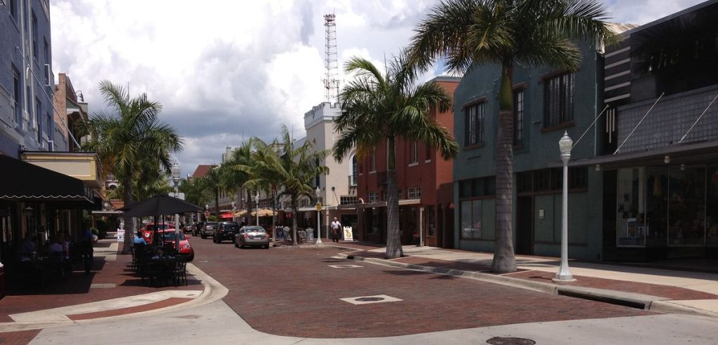 Brick-paved First Street lined with palm trees in historic downtown Fort Myers