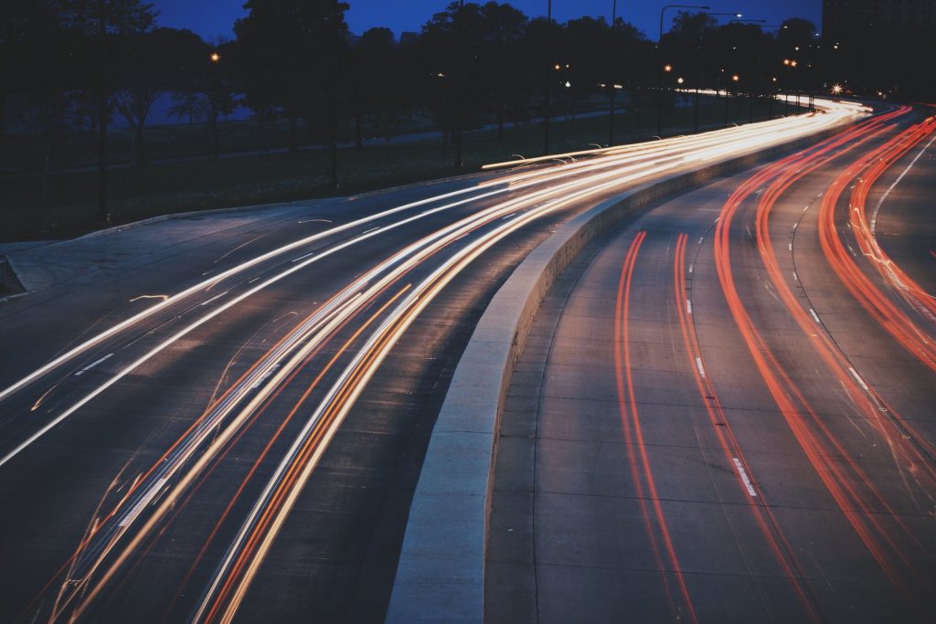 Car light trails on a highway at night