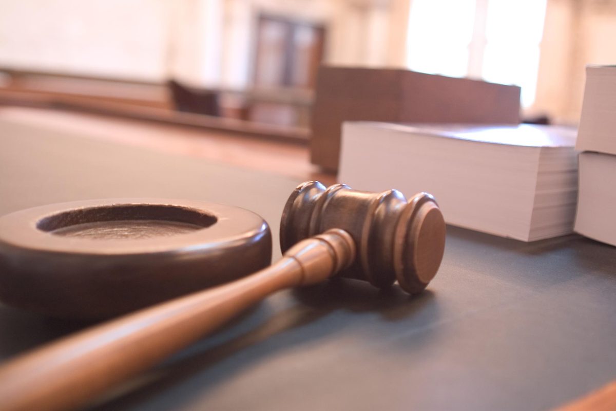 First appearance Hillsborough County: a judge's gavel and sound block on a courtroom bench beside stacked documents