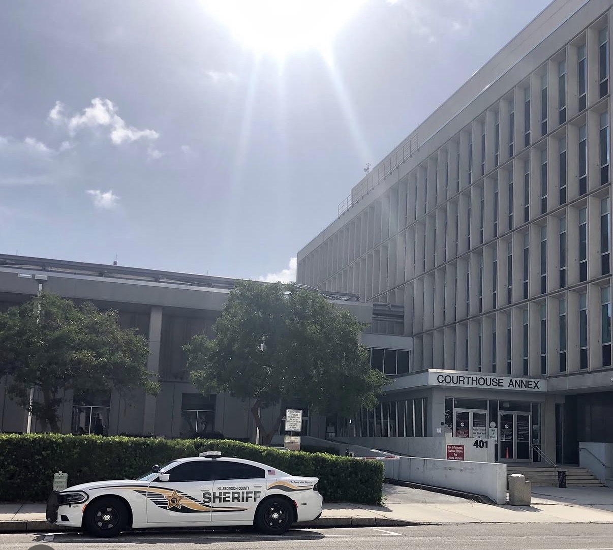 Hillsborough County courthouse in Tampa with a sheriff's car out front