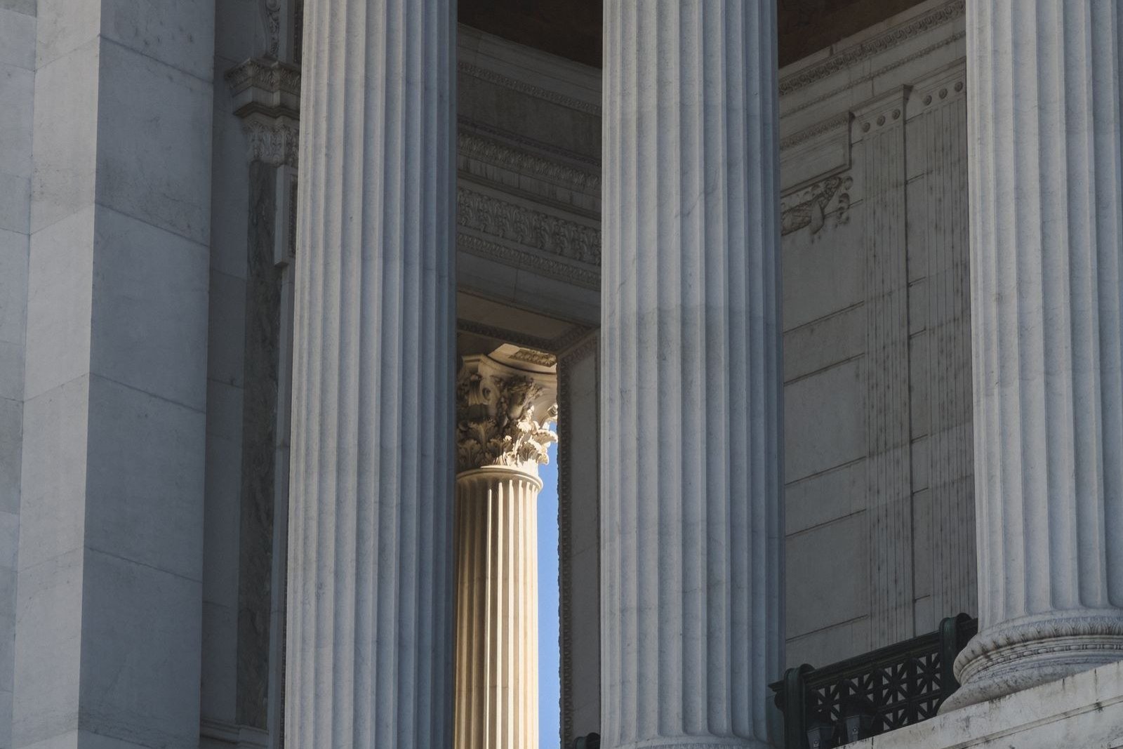 Tall stone columns on a classical building in soft light