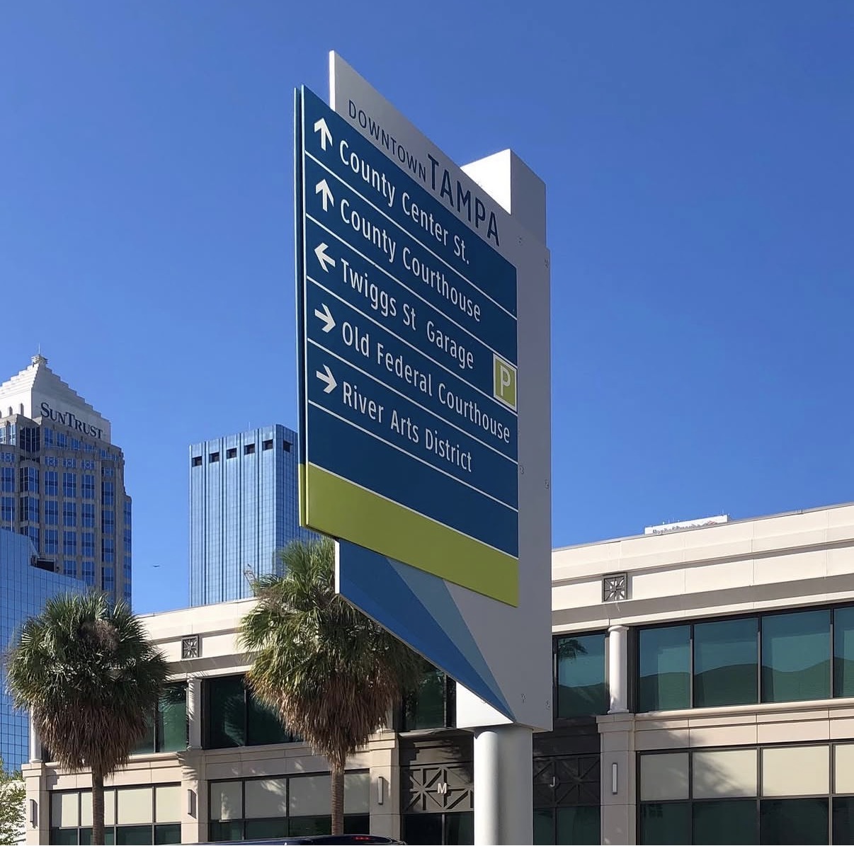 Downtown Tampa sign pointing to the county courthouse and Twiggs St. near The Frey Law Firm