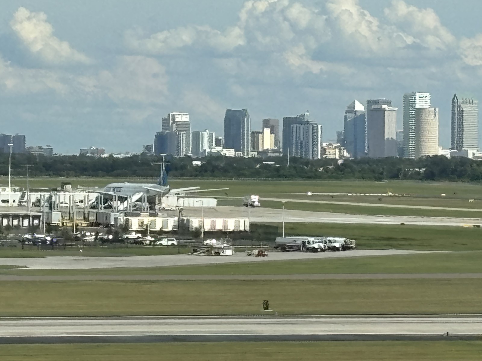 Tampa International Airport airfield with the downtown Tampa skyline in the distance